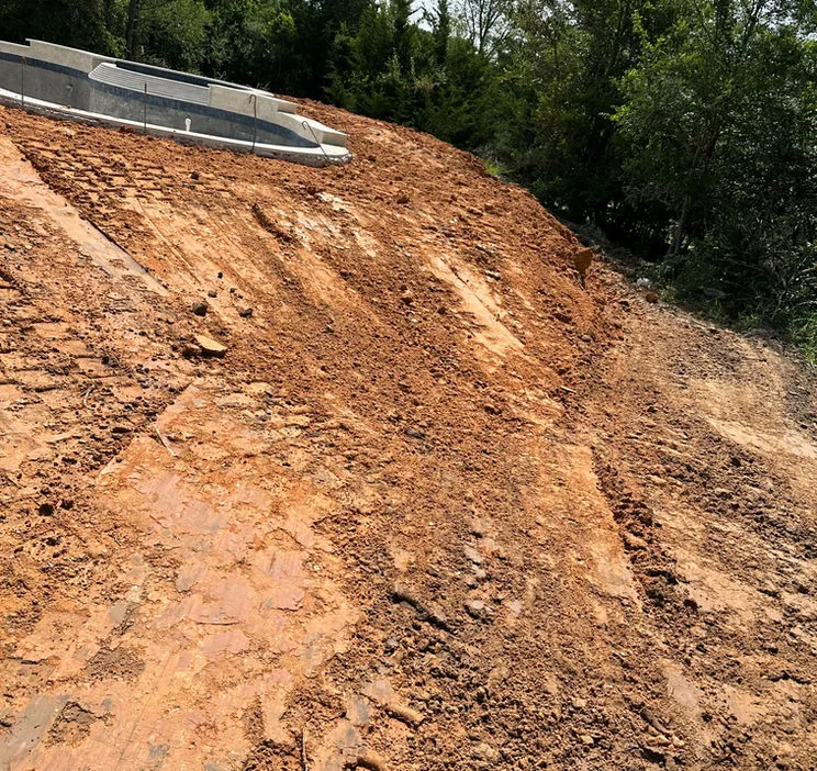 Graded slope prepared for drainage
