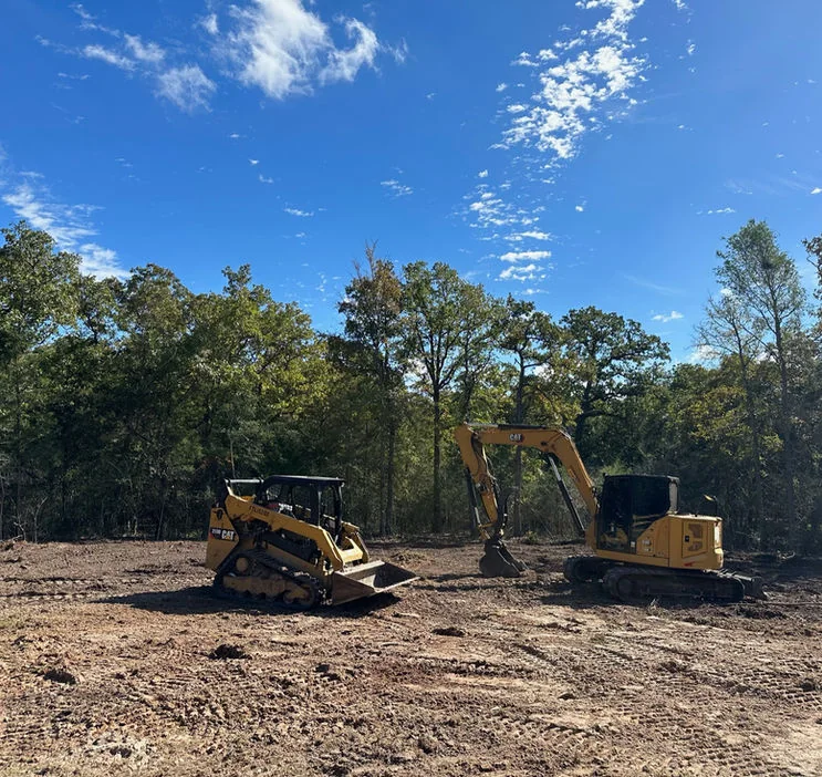 Double R equipment preparing a wooded site